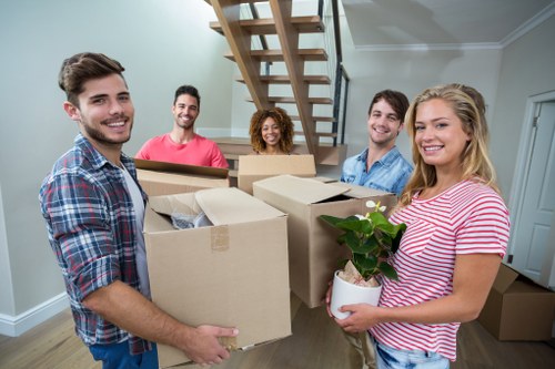 Removal team handling boxes and furniture during an Edgware house move