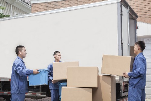 Careful unloading of household items at an Edgware property