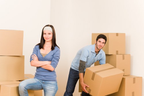 Professional movers handling furniture during a home relocation