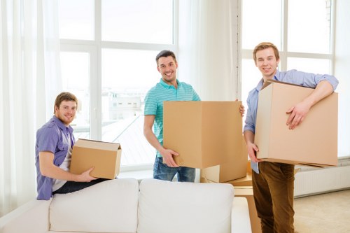 Loading boxes and furniture into a moving van in Edgware