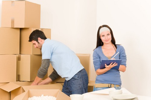 Professional movers handling furniture in an Edgware street