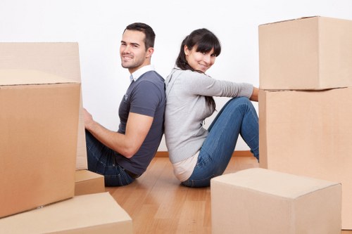 Commercial movers loading office items for a business move in Edgware