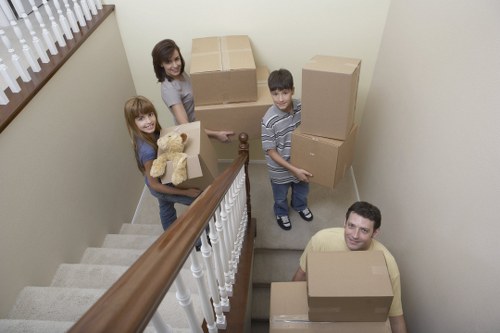 Careful loading of boxes into a van with attention to safety